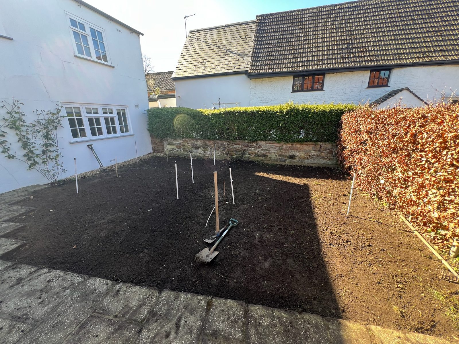 Bare levelled ground before planting, cottage garden