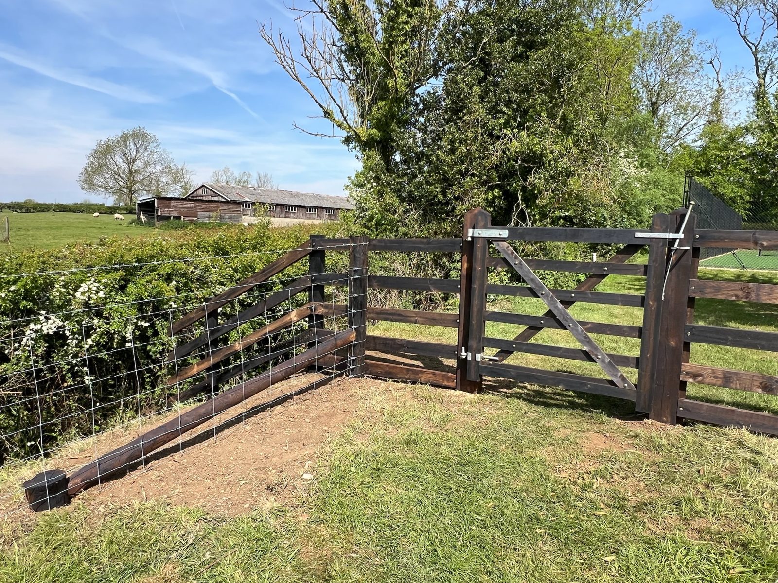 Post and rail fencing with stock wire and five-bar gate